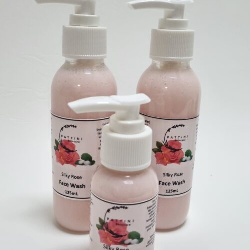 Three bottles of Pattini Skincare Silky Rose Face Wash with pump dispensers, featuring a pink rose design on the labels, arranged on a white background.