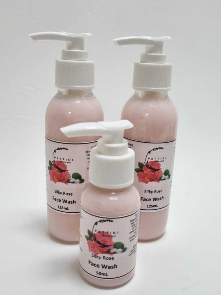 Three bottles of Pattini Skincare Silky Rose Face Wash with pump dispensers, featuring a pink rose design on the labels, arranged on a white background.