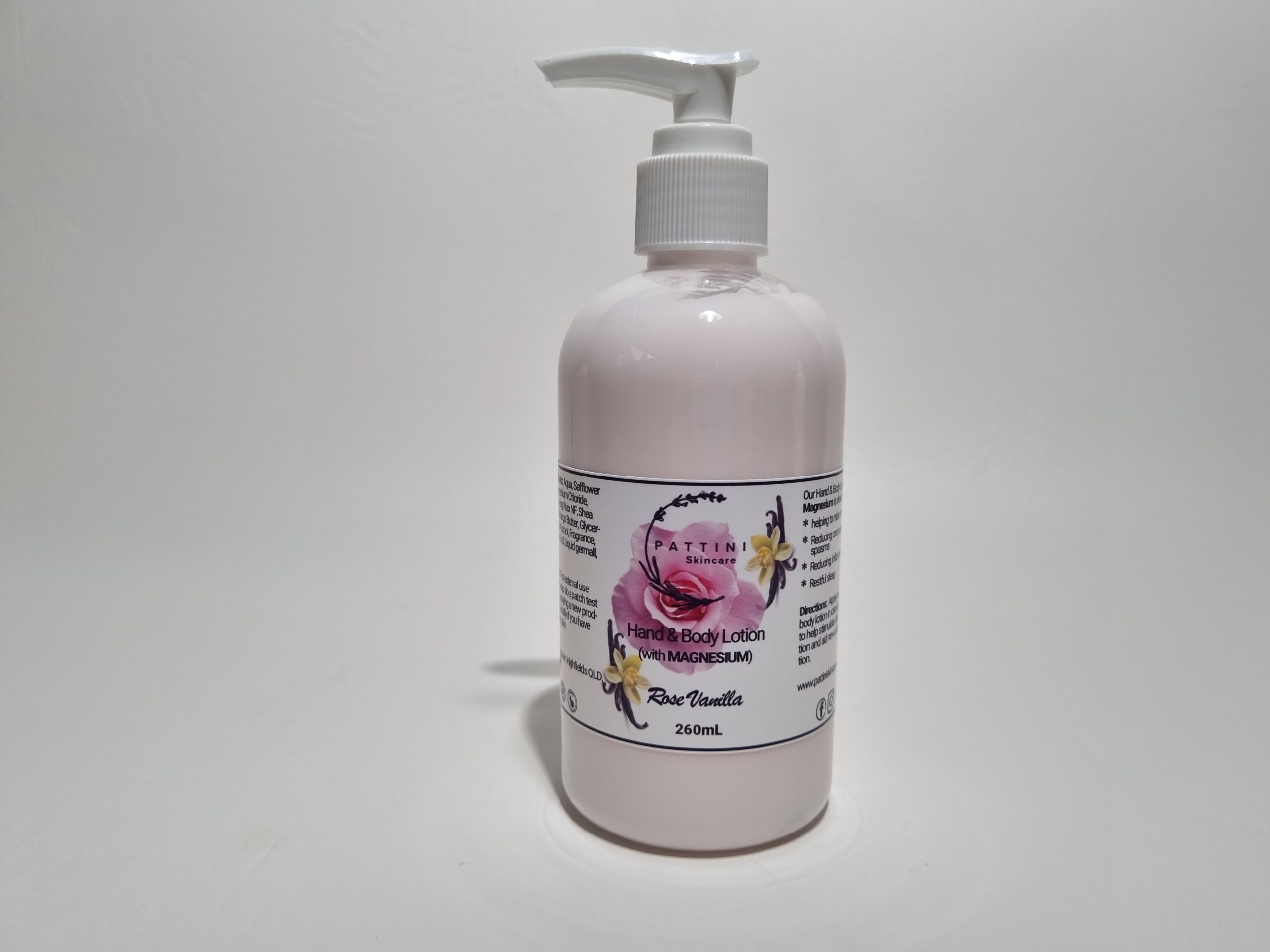 A light pink pump bottle of Pattini Skincare product labeled “Rose Body Lotion” placed against a plain white background.